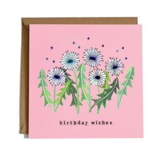 A square card featuring an illustration of dandelion clocks with stars around and the words 'birthday wishes' beneath, set on a pink background.