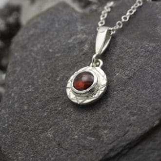 Argentium Silver and Garnet Necklace, handmade with the finest Silver in my UK workshop. Textured Sterling Silver Disc available in a Brushed or mirror polish to suit your style. January Birthstone necklace.