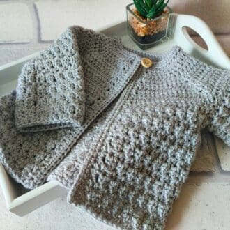 handmade crochet cardigan for newborn up to 2 years, the body has a lovely pattern adding detail and texture