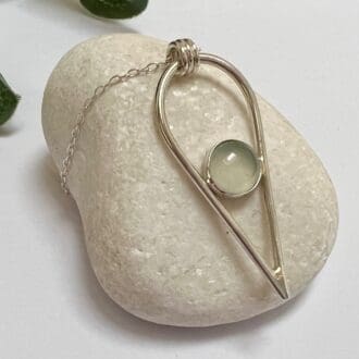 Handmade sterling silver inverted teardrop necklace with bezel set aqua chalcedony gemstone