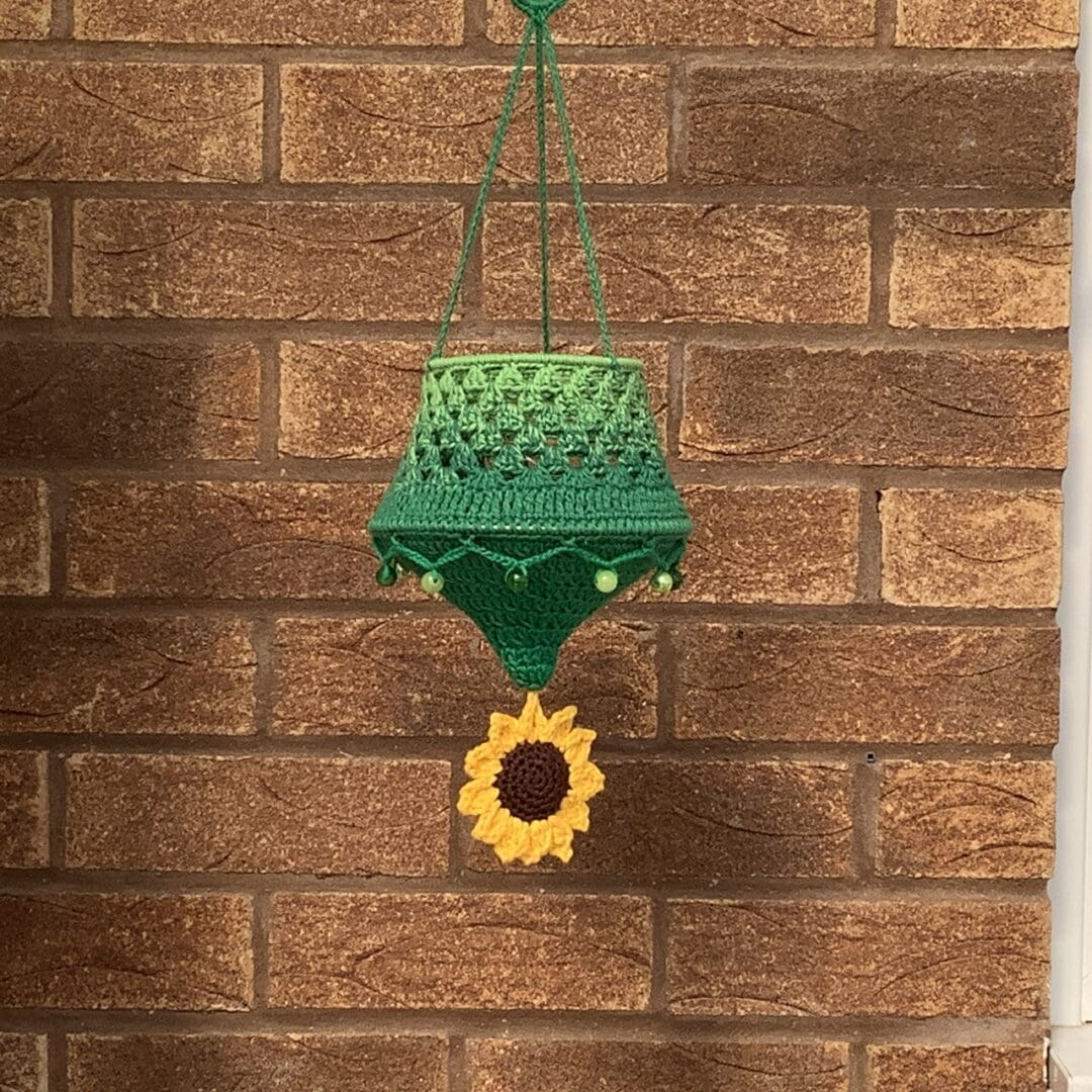 Crochet lantern with a sunflower