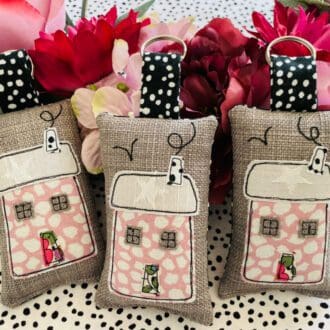 Pink country cottage keyring with pretty coloured door and chimney smoke embroidery