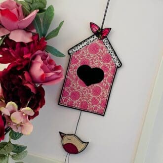 Fabric pink floral hanging bird house decoration with its own little bird