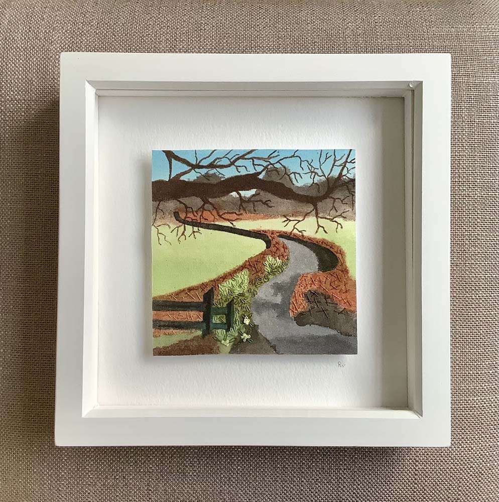 embroidered scene of a country lane