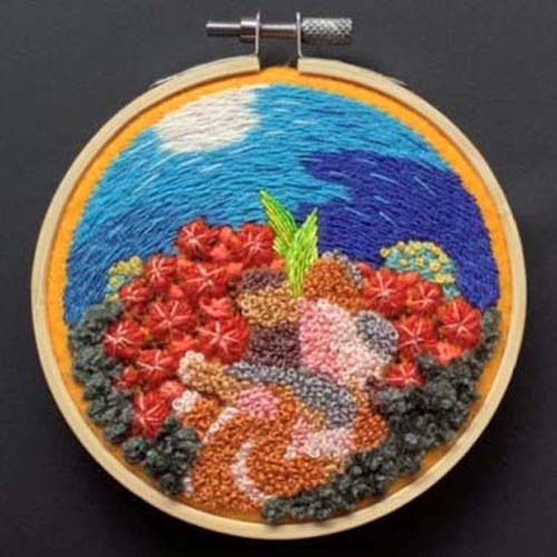 a hand embroidered underwater scene