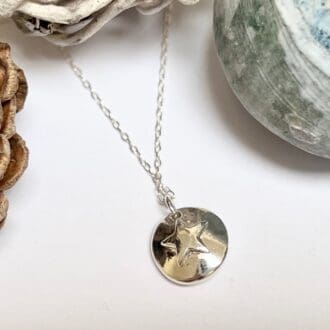 Handmade silver moon and star double sided necklace