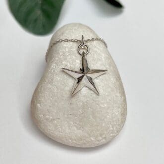 A handmade silver star necklace with choice of chain