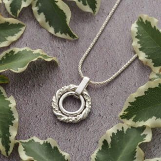 Handmade sterling silver hoop circle pendant necklace made with a trio of twisted wires