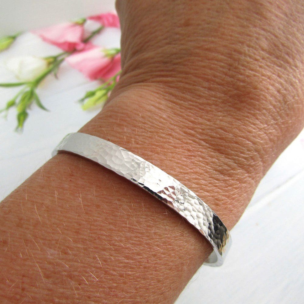 6mm hammered textured aluminium cuff bracelet with a personalised hand-stamped message hidden inside