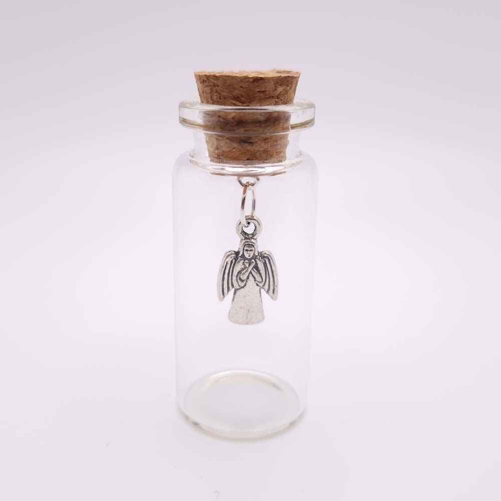silver angel charm enclosed in a miniature glass bottle