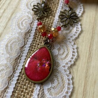antique bronze necklace with red and glitter resin teardrop pendant