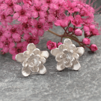 Sterling silver flower stud earrings.