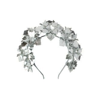 silver leather flowers mounted on a thin headband on white background