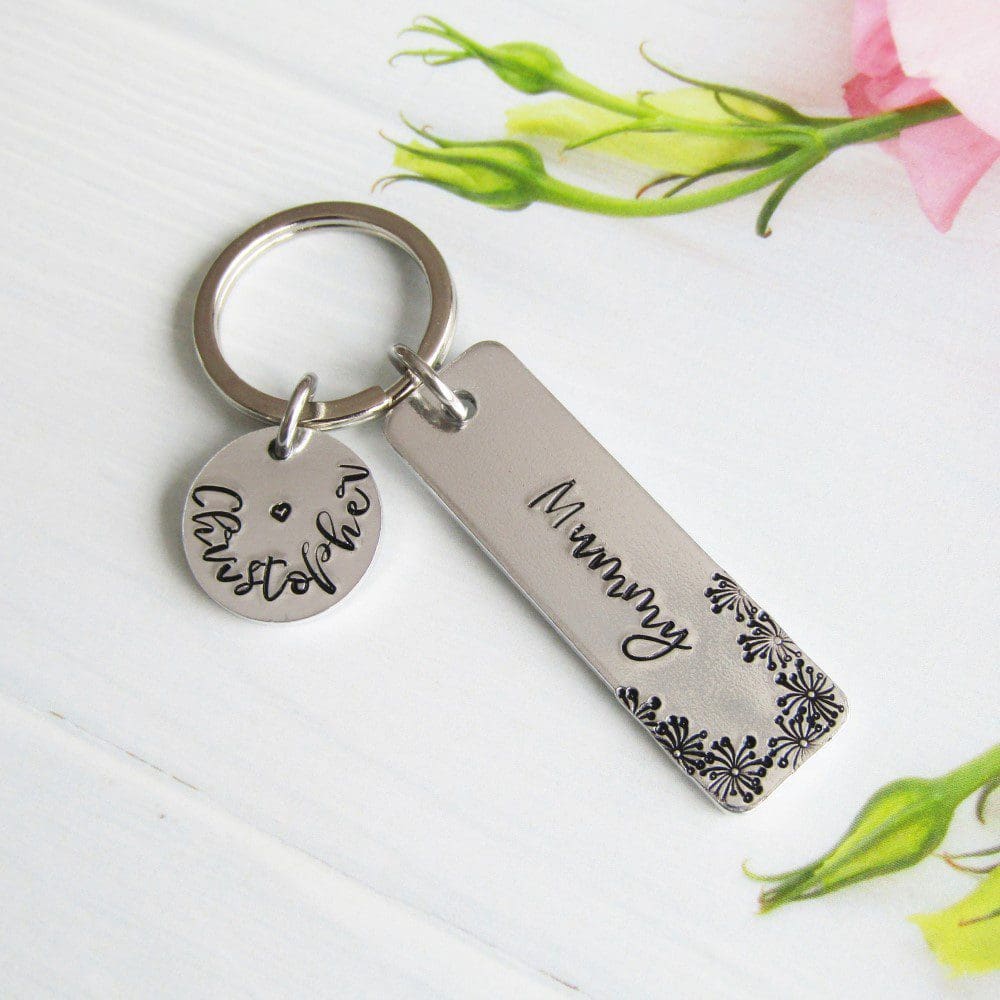 rectangular keyring hand-stamped with Mummy with flower detailing and a personalised name disc with a child's name stamped on it