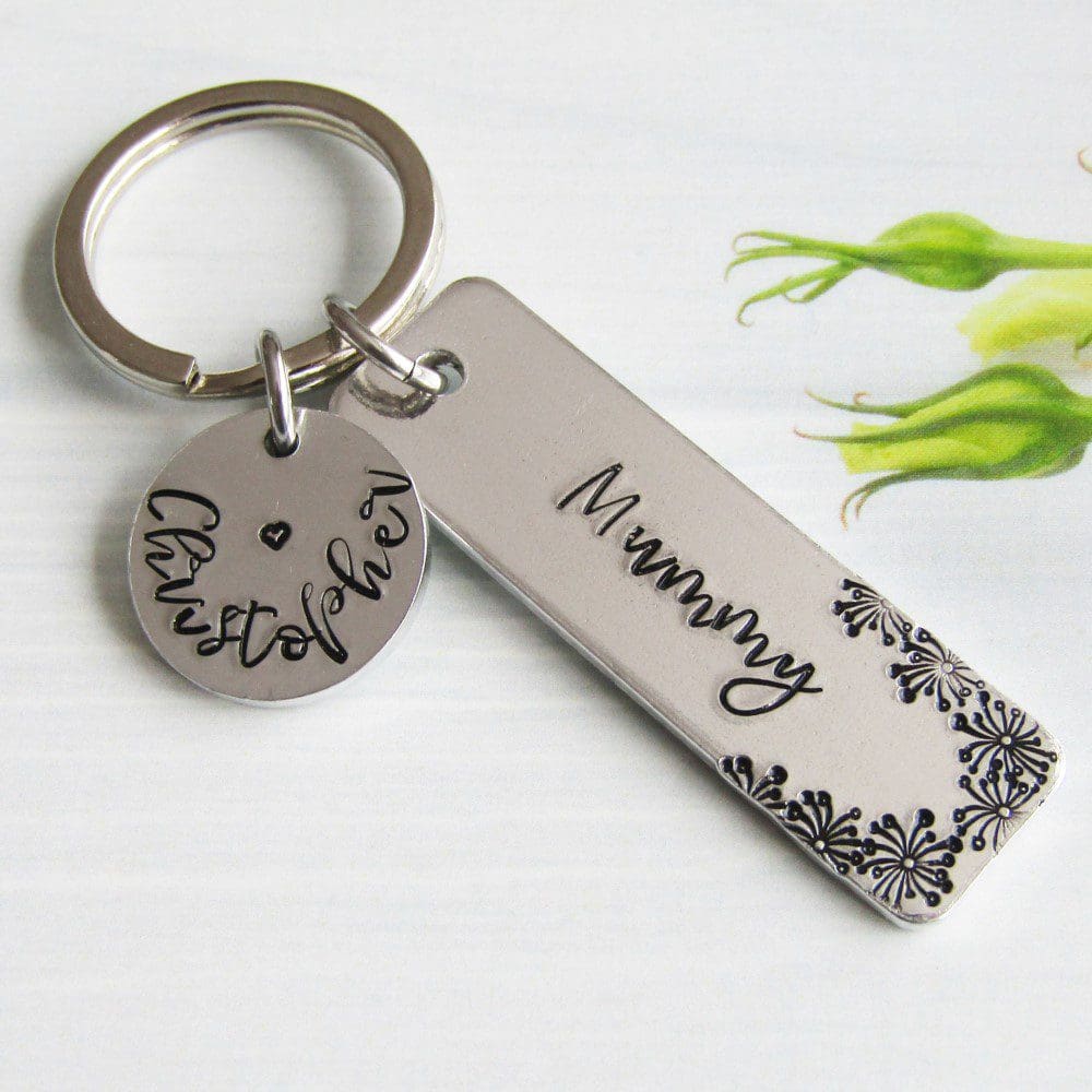 rectangular keyring hand-stamped with Mummy with flower detailing and a personalised name disc with a child's name stamped on it