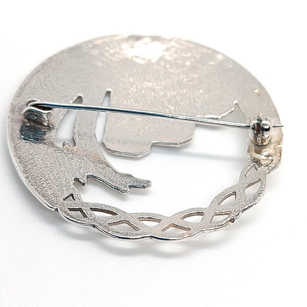 round brooch seen from behind witha safety catch. Made in Sterling silver.