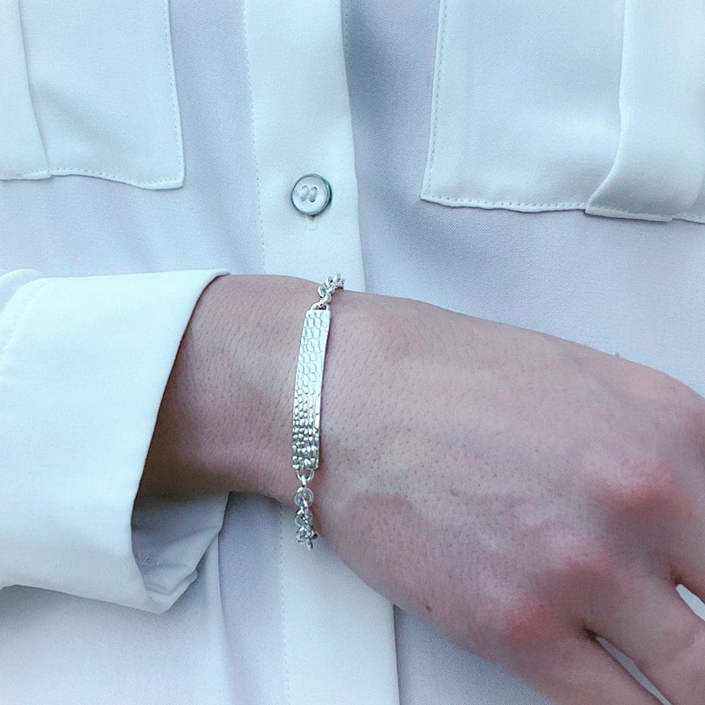 sterling silver snake print bar bracelet on wrist