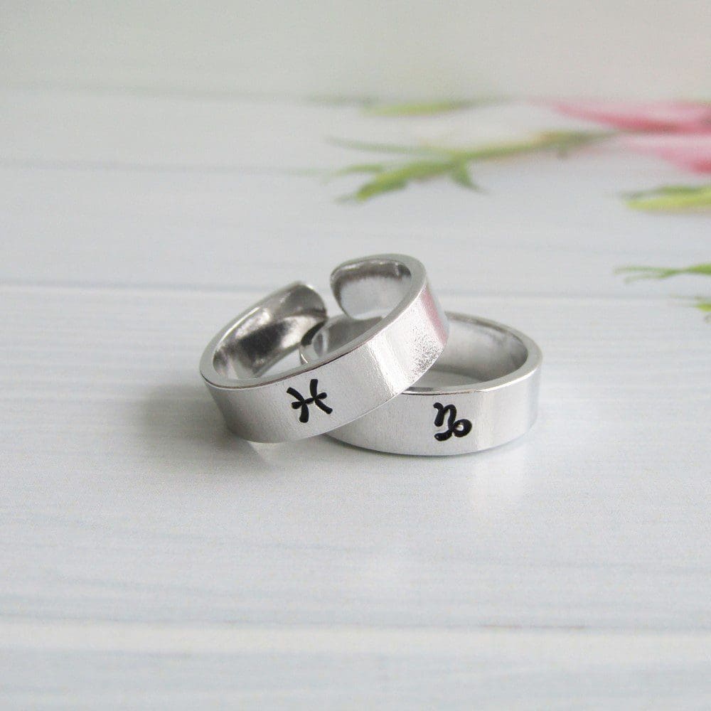 6mm wide aluminium cuff ring with a hand-stamped zodiac symbol on the front