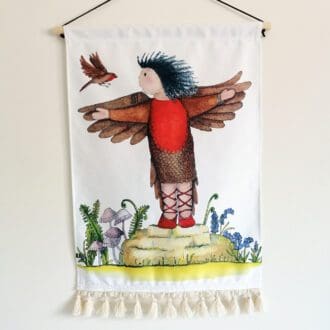 Cotton wall hanging featuring a toddler dressed as a red bird with her wild Robin friend. High quality wall art in soft but heavy duty cotton. Great for a nursery, child's bedroom or playroom.