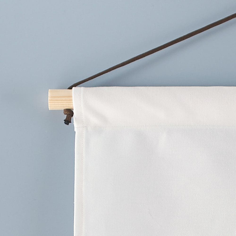 Detaied photo of the wall hangings wooden hanger with waxed cotton chord hanger.