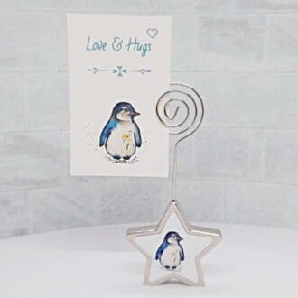 Aluminium star shaped phot holder with Penguin artwork with a pocket hug card