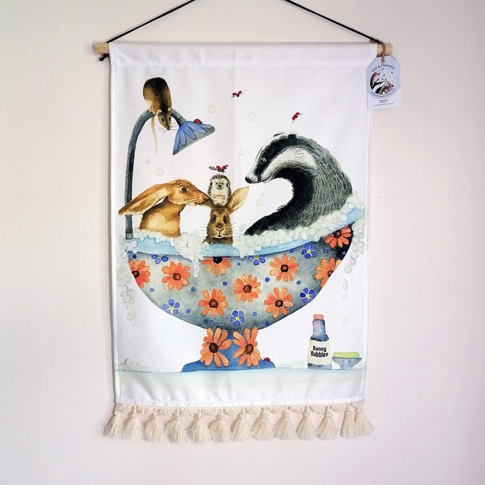 Cotton wall hanging featuring hares, hedgehogs, a badger and mouse enjoying a bath together. Ideal for a bathroom, child's nursery, bedroom or playroom