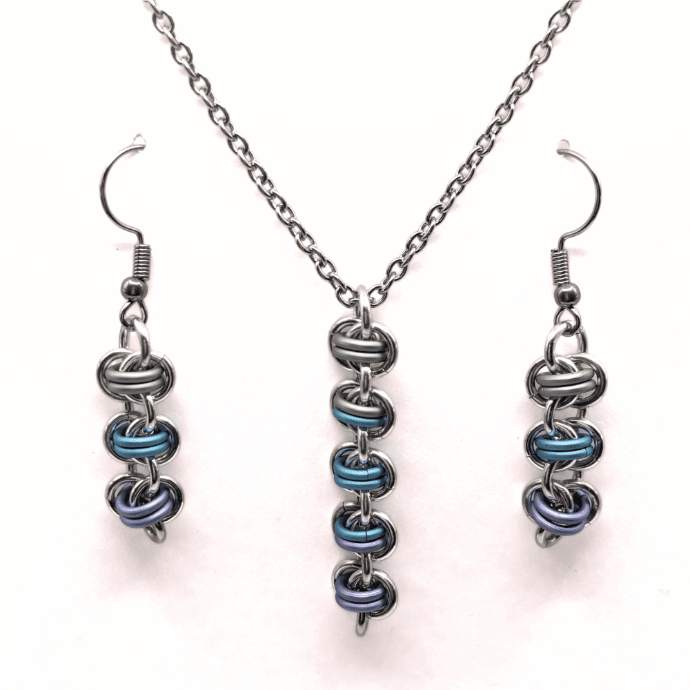 barrel weave chainmaille necklace and earring set made with silver and pastel green, blue and purple rings