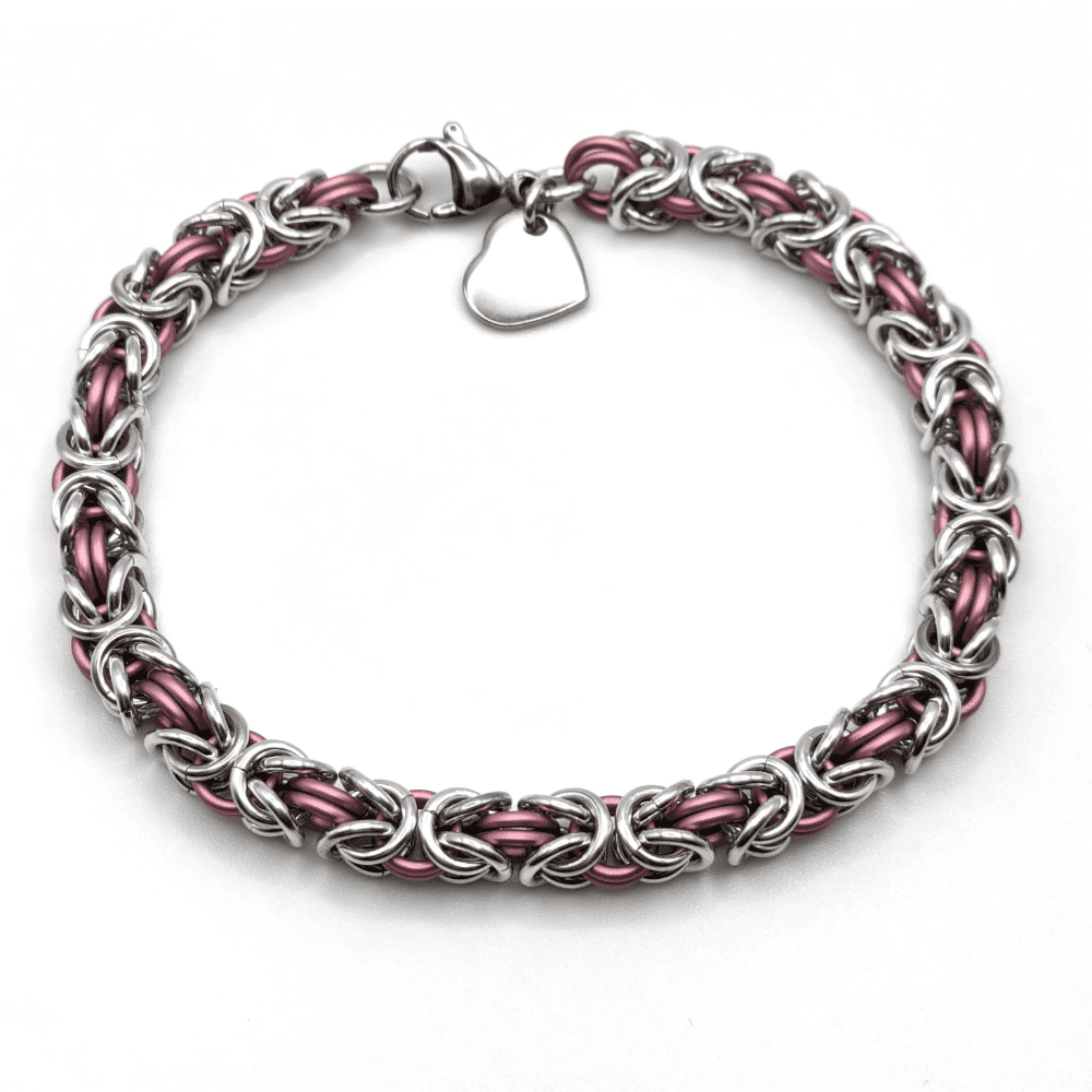 Byzantine bracelet made with silver and matt pastel pink rings with a stainless steel charm