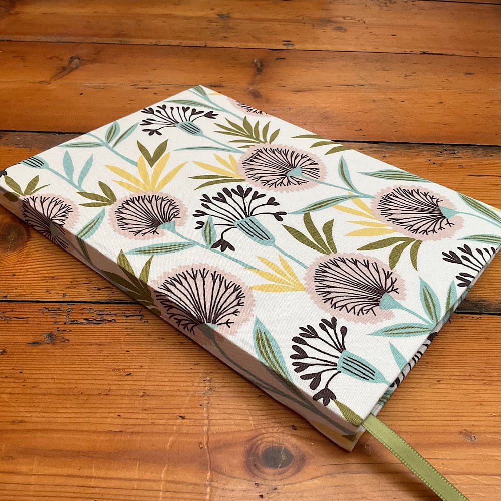 Handcrafted A5 Notebook filled with plain paper covered in seedhead fabric