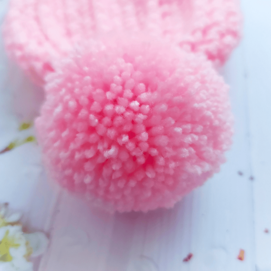 pink handmade yarn pom pom