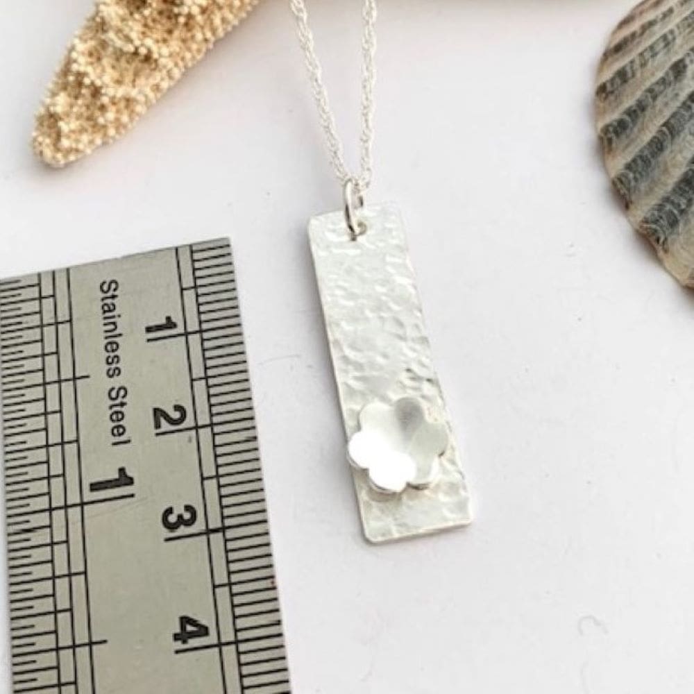 Sterling silver textured flower pendant