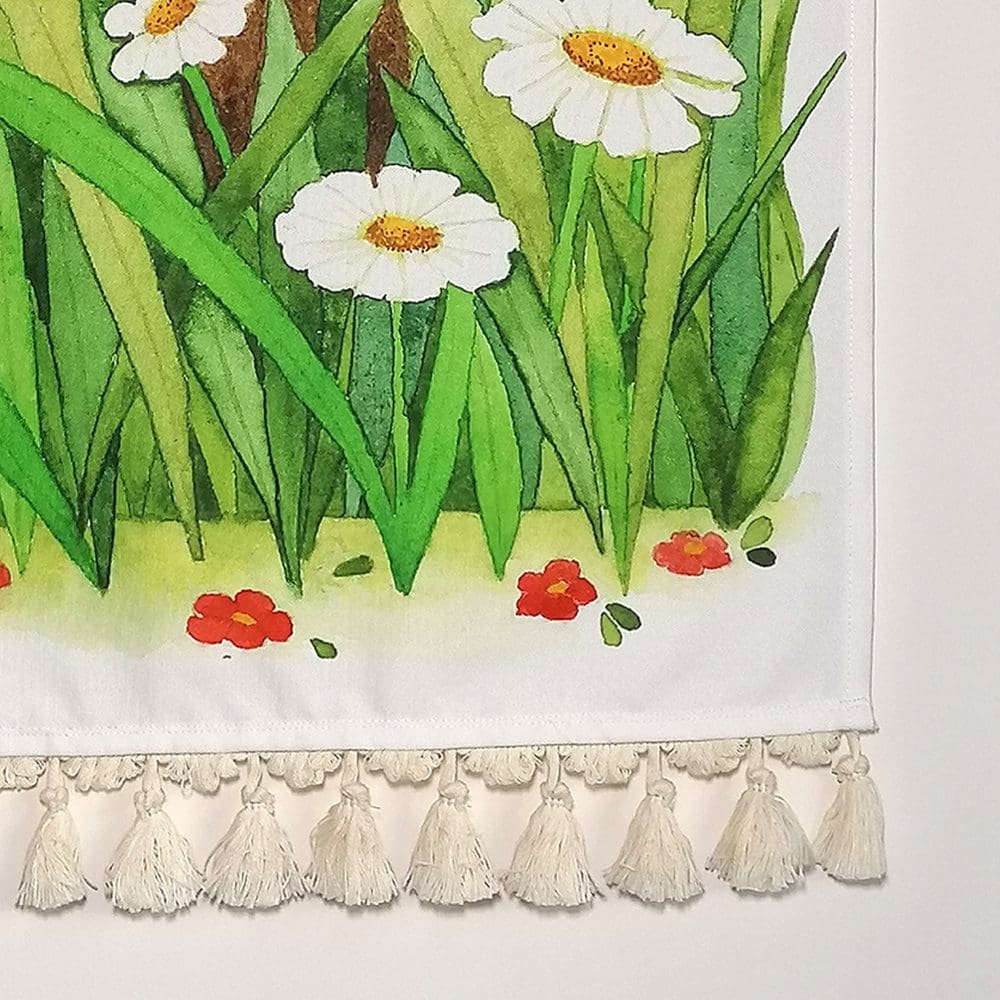 Close up detail of the rabbit and butterfly wall hanging - printed heavyweight cotton fabric and pale cream cotton tassel decoration. Original illustration created as a watercolour painting.