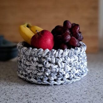 Blue and white patterned crochet fruit basket