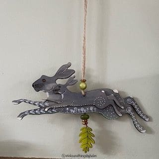 grey hare green beads wall hanger