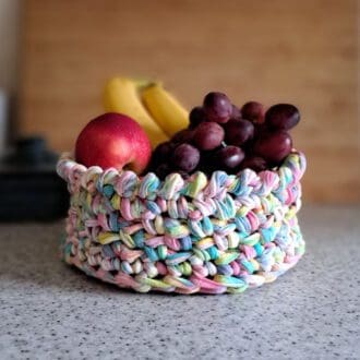 A multicoloured crochet storage basket