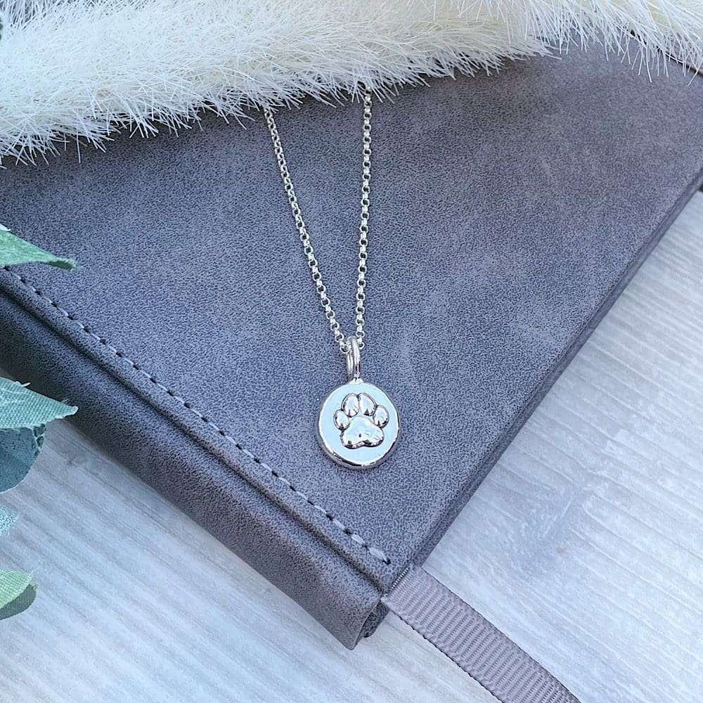 sterling silver paw print pebble necklace