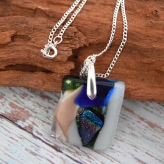 unusual Dichroic glass necklace on a silver plated chain