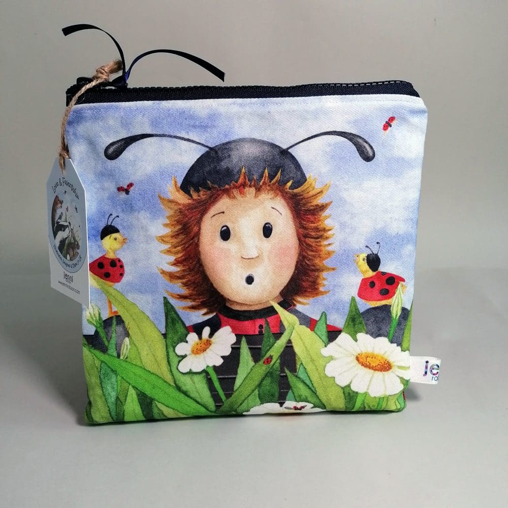 A gorgeous and beautifully made square toiletries bag with a ladybug character and two duckling friends on the front and a bright red back. Lined with water resistant lining it also has an internal pocket. Sealed with a chunky zipper fastening with a satin ribbon zip pull. Ideal to carry stationery or toiletries.