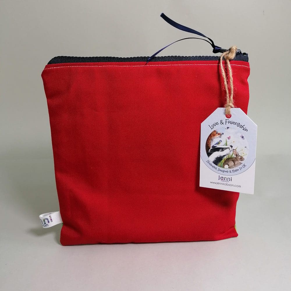 Vibrant red cotton back view of the Ladybug toiletries bag with a chunky zipper fastening.