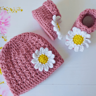 Handmade baby gift set including a daisy beanie hat and matching booties, these are colour pale rose but there are various colours to choose from