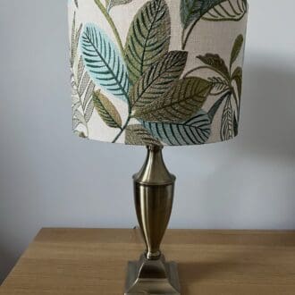 embroidered leaf patterned drum lampshade in green and turquoise. 3 sizes available,25cm diameter x 20cm high 30cm diameter x 20cm high and 40cm diameter x 25cm high