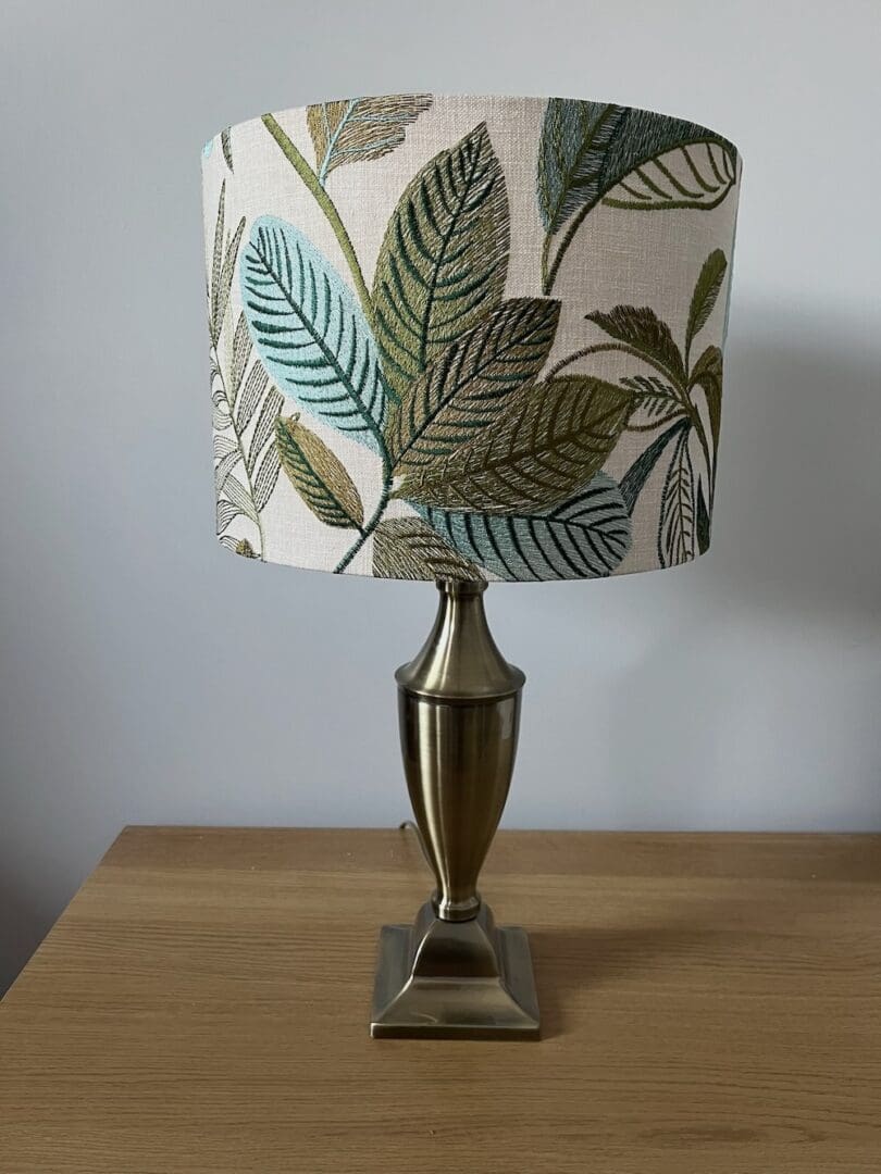 embroidered leaf patterned drum lampshade in green and turquoise. 3 sizes available,25cm diameter x 20cm high 30cm diameter x 20cm high and 40cm diameter x 25cm high