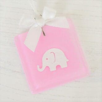 Handmade pink fused glass keepsake with paper cut elephant