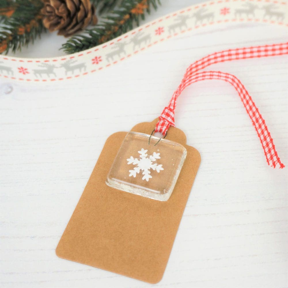 Kraft gift tag with handmade fused glass and paper cut snowflake keepsake