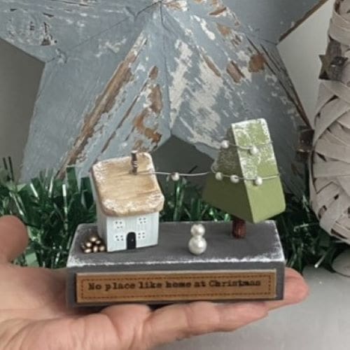 Handmade miniature wooden house festive scene Christmas decoration