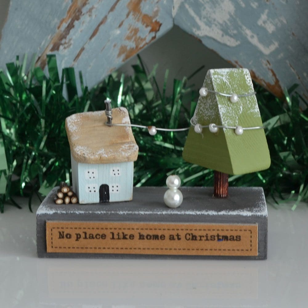 Handmade miniature wooden house festive scene Christmas decoration