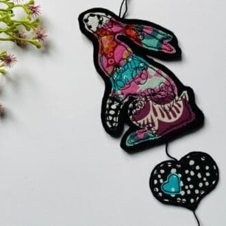 Pink and purple moon gazing hare hanging decoration with patchwork free motion detail and spotty hanging heart, stocking filler gift