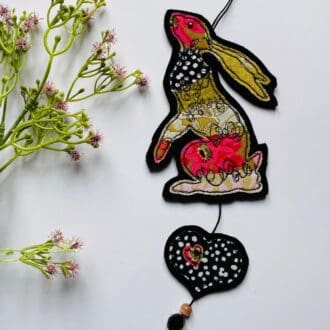 Moon gazing hare wall hanging decoration with beaded heart decor, patchwork fabric design