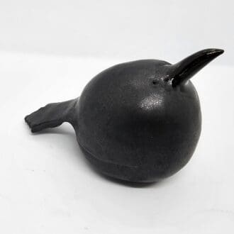 Ceramic crow facing to the right