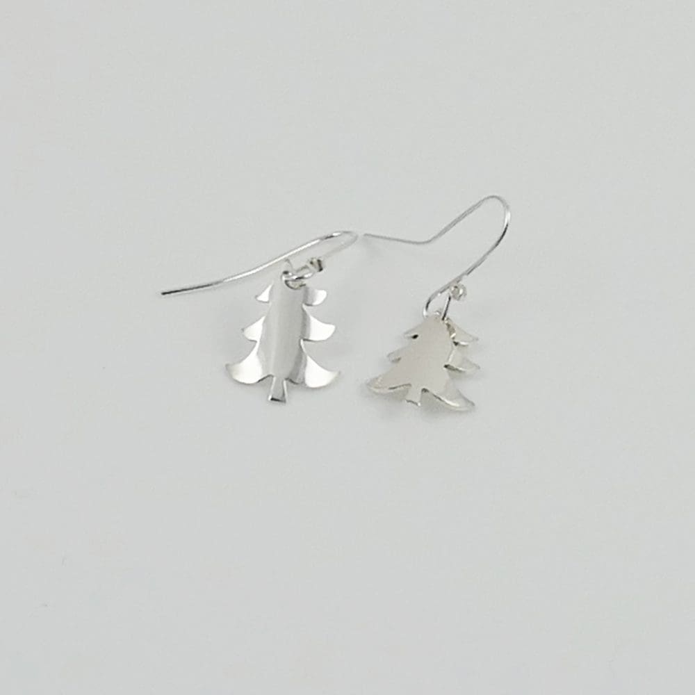 recycled-sterling-silver-christmas-tree-ear-drops-laying-on-a-white-background